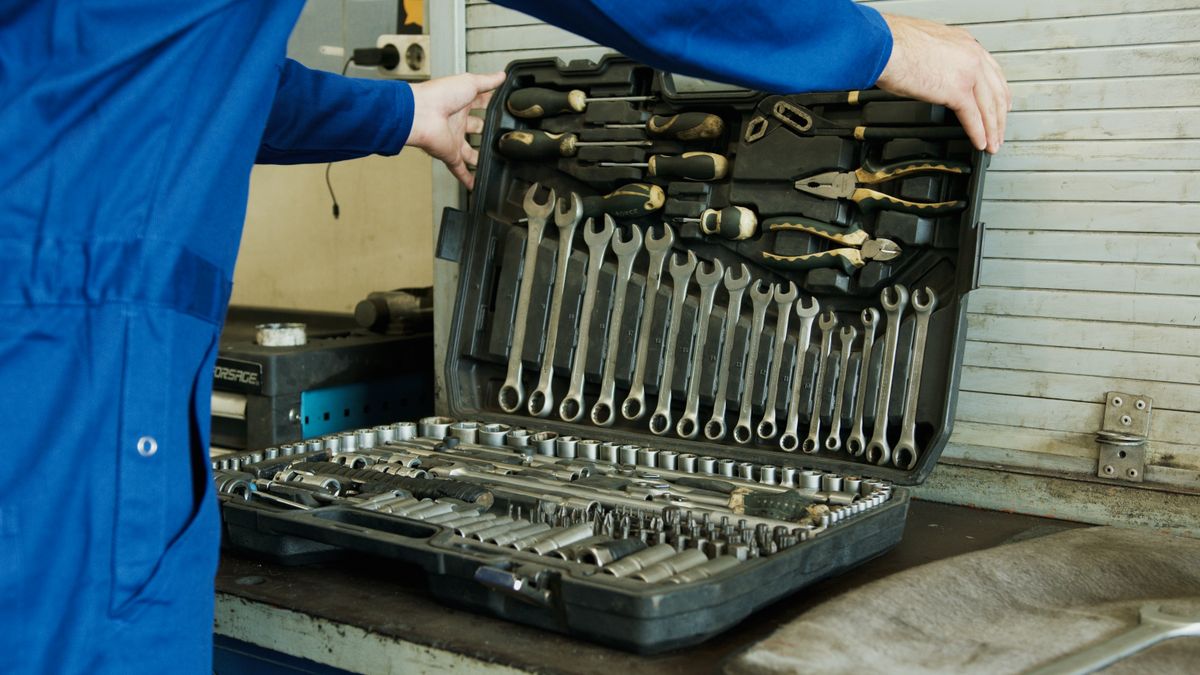 A member of the Carter's team with an electrical tool kit