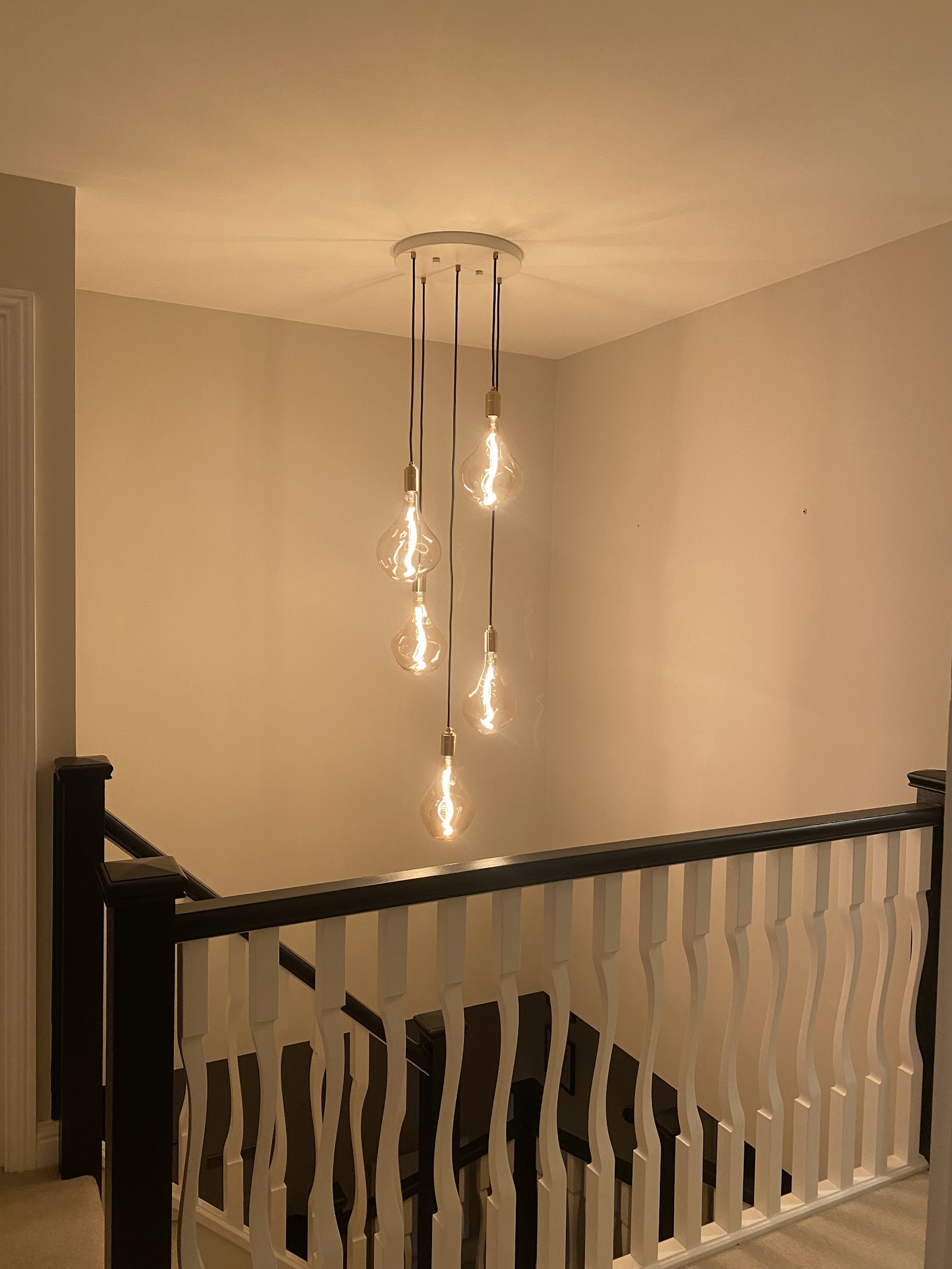 Feature pendant cluster wired over a stairwell